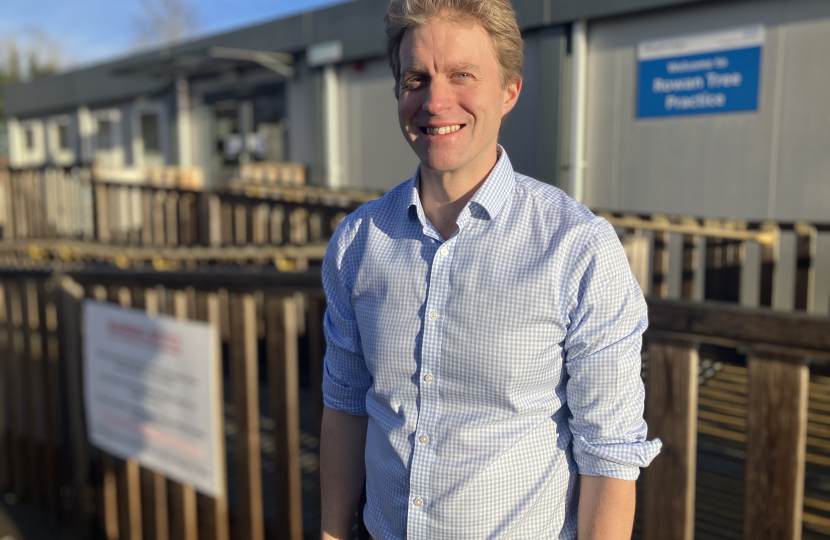 Dr Ben Spencer MP outside the temporary health centre buildings in Weybridge