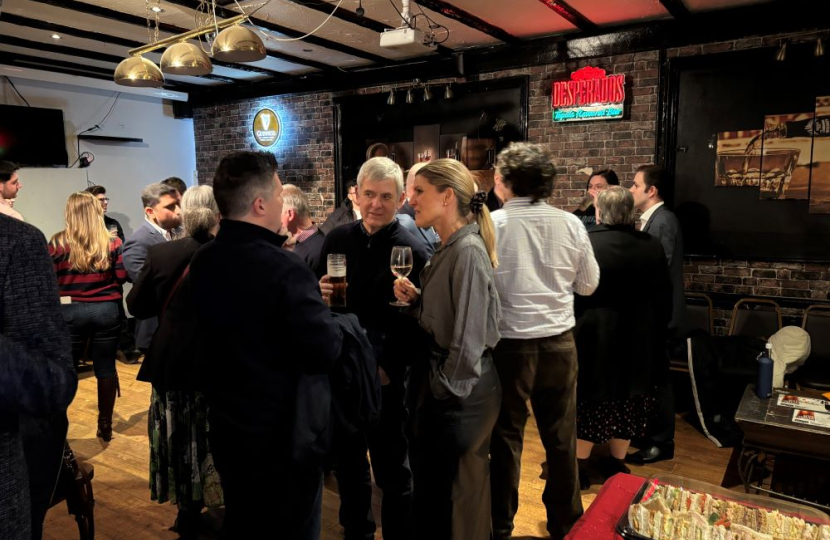 Members enjoy a drink and a chat