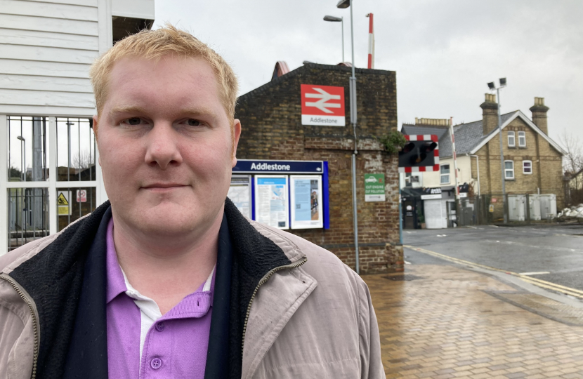 Cllr Jonathan Wilson outside Addlestone Station