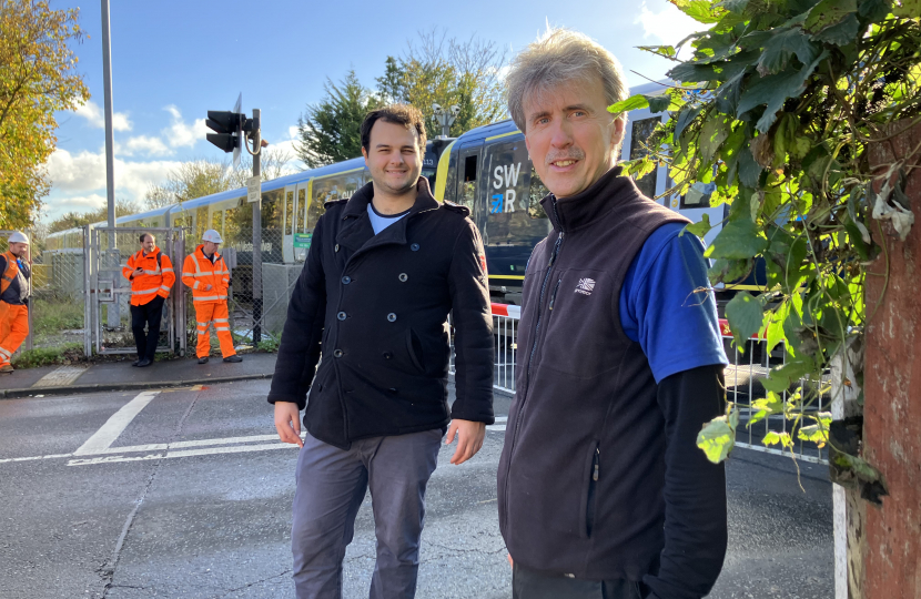 Cllr Alex Balkan and Mark Adams at the Egham crossing