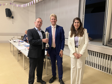 Neva Novaky and Ben Spencer present a cup to Oatlands Branch Chair Ben White