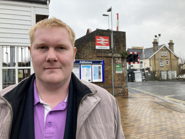 Cllr Jonathan Wilson outside Addlestone Station